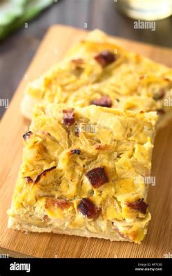 Zwiebelkuchen – A Savory Symphony of Caramelized Onions and Spiced Dough!